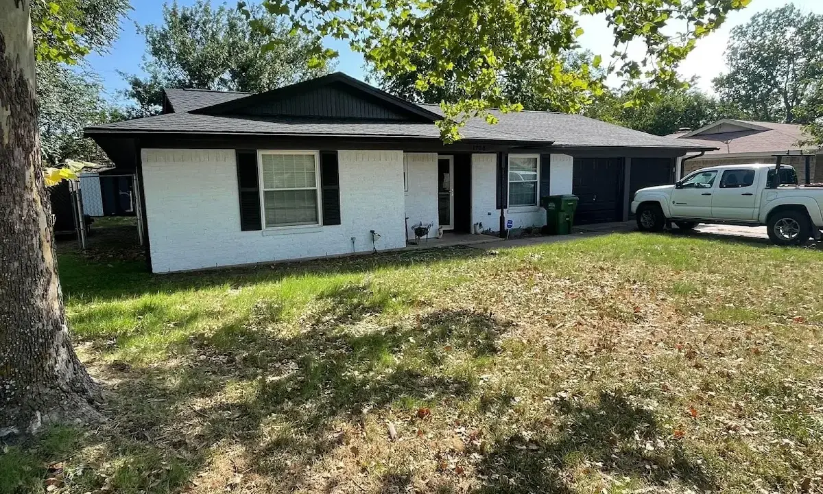 Professional roofing crew working on a residential roof in Sylacauga